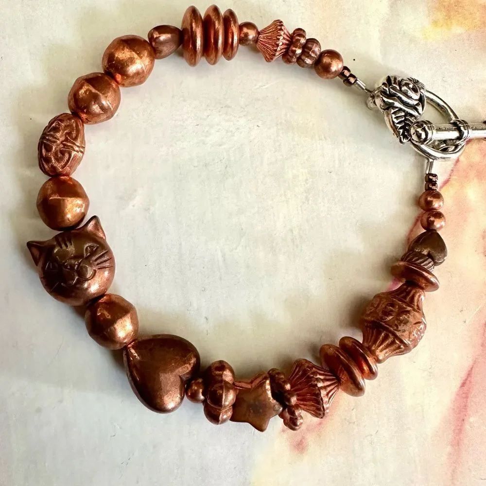 Copper tone cat heart star beaded bracelet